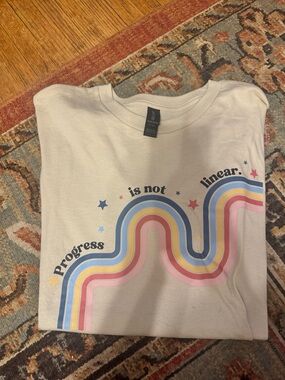 Womans 'Progress is Not Linear' Rainbow Graphic Tee - Cream
